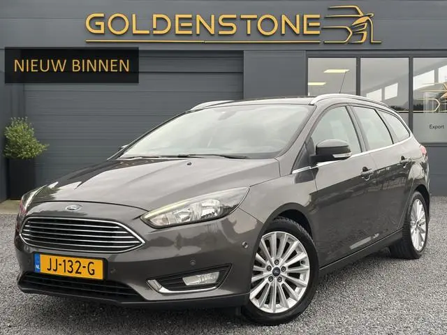 Ford Focus Wagon 1.0 Titanium 2e Eigenaar,Trekhaak,Navi,125pk,PDC V+A,6 Bak,Clima,Cruise,N.A.P,Lm ve...