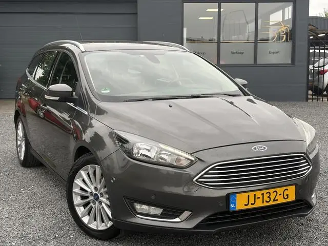 Ford Focus Wagon 1.0 Titanium 2e Eigenaar,Trekhaak,Navi,125pk,PDC V+A,6 Bak,Clima,Cruise,N.A.P,Lm ve...