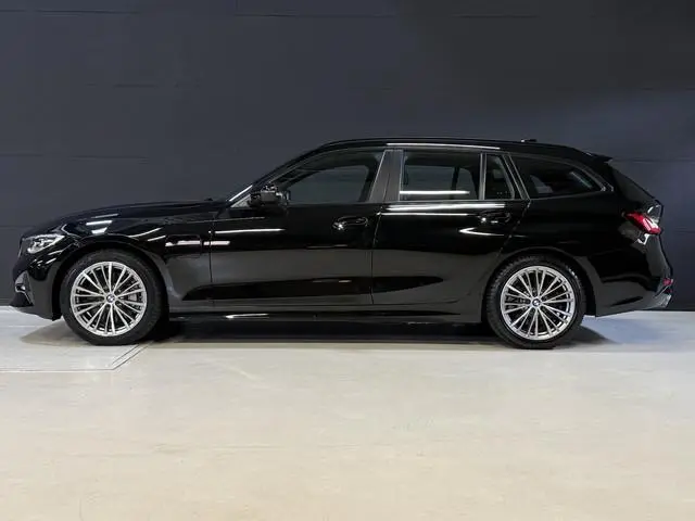 BMW 3-serie Touring 330e Business Edition Plus | Vol leder | Elektr. trekhaak | Harman/Kardon