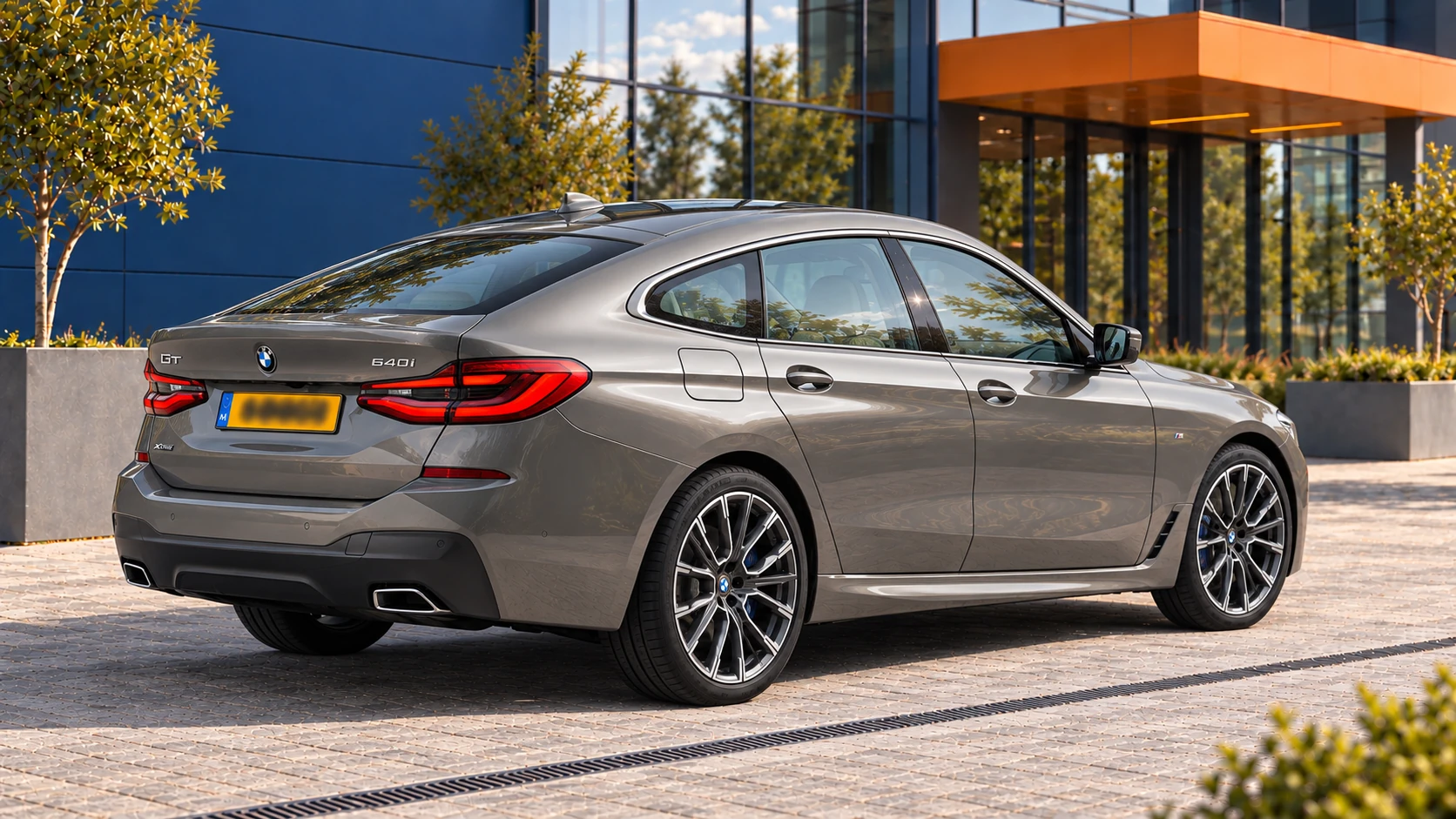 Achterzijde van een BMW 640i xDrive Gran Turismo G32-facelift in Bernina Grey